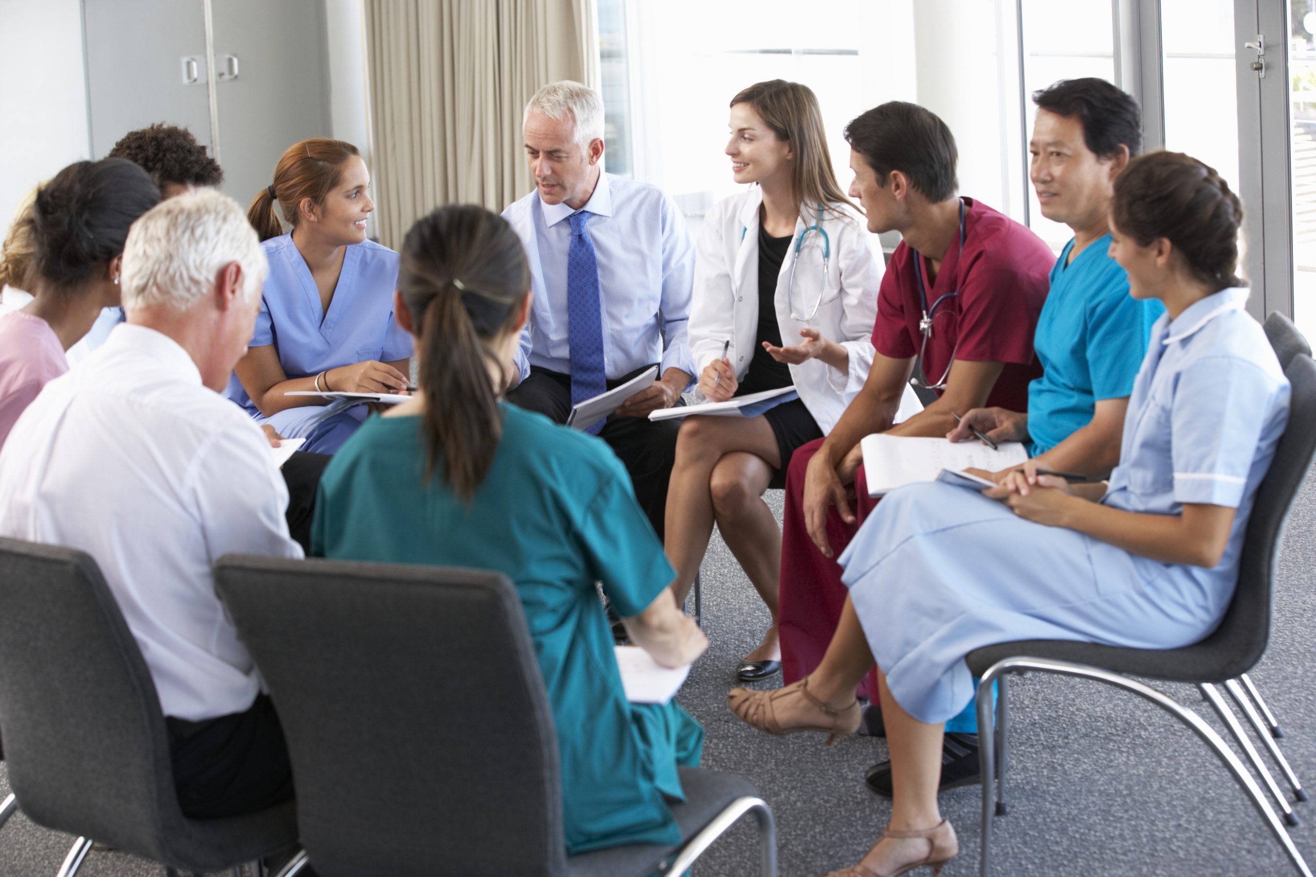 medical staff seated in circle